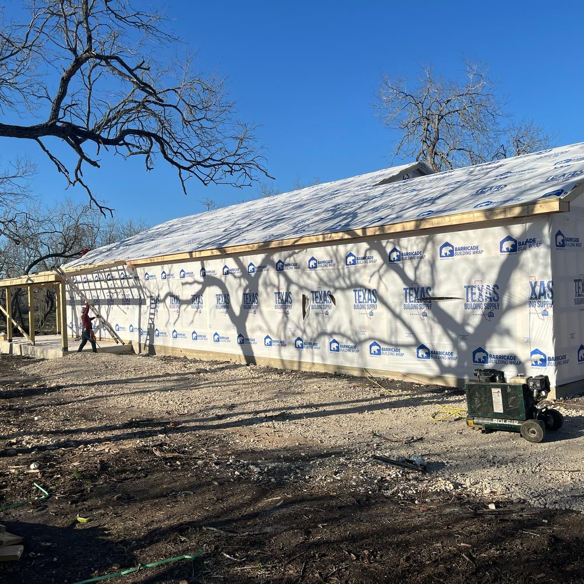 House wrap and roof framing stage