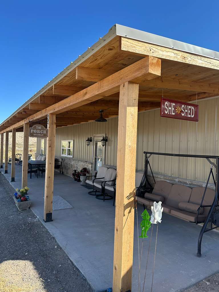 Covered porch with swing and cedar columns